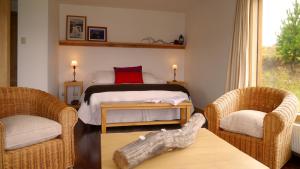 Säng eller sängar i ett rum på Cinco Ríos Lodge
