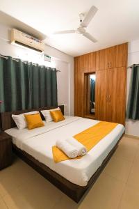 Posteľ alebo postele v izbe v ubytovaní High Q Suites