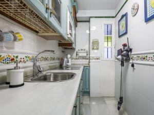 Kuchnia lub aneks kuchenny w obiekcie Sueños de Sevilla duplex a calidades