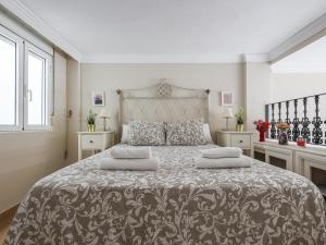 Łóżko lub łóżka w pokoju w obiekcie Sueños de Sevilla duplex a calidades