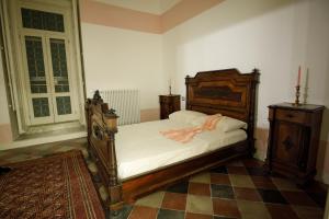 A bed or beds in a room at Palazzo Introna
