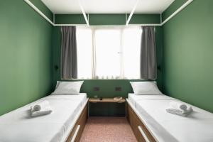 Postel nebo postele na pokoji v ubytování Zeus is Loose Hostel