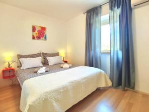 Postel nebo postele na pokoji v ubytování Jasmina Apartment