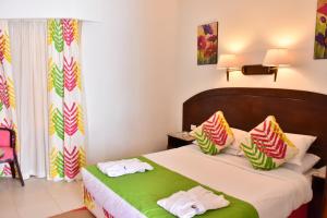 سرير أو أسرّة في غرفة في Gafy Resort Aqua Park