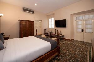 TV a/nebo společenská místnost v ubytování Hotel Senorial