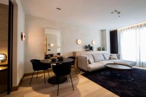 a living room with a couch and a table at Zenit Convento San Martin in Donostia-San Sebastián