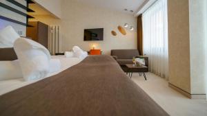 Postel nebo postele na pokoji v ubytování Grand Hotel BELLEVUE