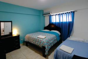 Postel nebo postele na pokoji v ubytování Hostal Magisterial Santo Domingo