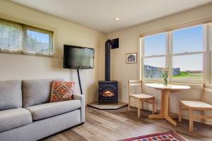 a living room with a couch and a stove at Headlands View in Mendocino