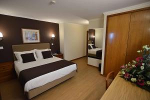 Postel nebo postele na pokoji v ubytování Hotel Salgueiro
