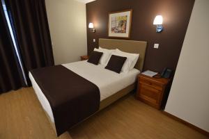 Postel nebo postele na pokoji v ubytování Hotel Salgueiro