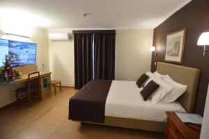Postel nebo postele na pokoji v ubytování Hotel Salgueiro