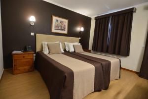 Postel nebo postele na pokoji v ubytování Hotel Salgueiro + 37 fotografií