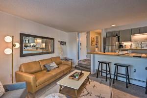 a living room with a couch and a kitchen at quarter Mi to Peak 8 Ski Lift Modern Breck Condo! in Breckenridge
