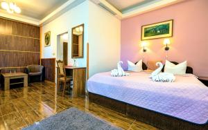 Posteľ alebo postele v izbe v ubytovaní Hotel Džbán