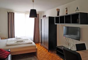 Łóżko lub łóżka w pokoju w obiekcie Central living - Stephansdom Apartments