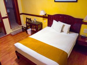 Postel nebo postele na pokoji v ubytování Hotel Madan Cárdenas