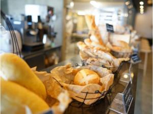 a bunch of breads and pastries on a counter at OGAL INN - Vacation STAY 01861v in Akaishi