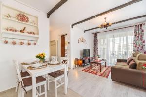 a living room with a table and a couch at Dream Apartments Brasov in Braşov