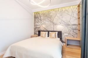 Posteľ alebo postele v izbe v ubytovaní Super-Apartamenty International Fair