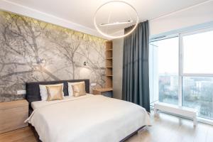 Posteľ alebo postele v izbe v ubytovaní Super-Apartamenty International Fair