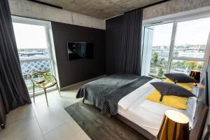 Posteľ alebo postele v izbe v ubytovaní Super-Apartamenty International Fair