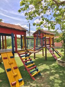 a row of playground equipment in a park at Pousada Cascata de Pedra in Pirenópolis