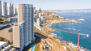 an aerial view of a city and the ocean at Departamento full vista al Mar ReñacaConcon in Viña del Mar