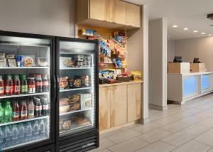 a store with an open refrigerator in a cafeteria at Holiday Inn Express Hotel & Suites Olive Branch, an IHG Hotel in Olive Branch