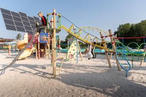 a group of children playing on a playground at Vakantiepark Wilhelm Tell Superieur Chalet in Opglabbeek