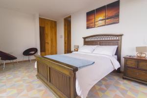 Postel nebo postele na pokoji v ubytování Hotel Casa Portones