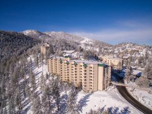 a resort in the snow with a mountain at Holiday Inn Club Vacations - Tahoe Ridge Resort in Stateline