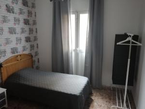 A bed or beds in a room at Alcaravaneras Hostel