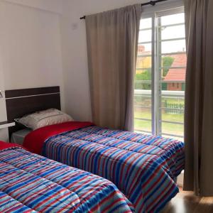 Voodi või voodid majutusasutuse Dúplex de categoría a una cuadra de la playa toas