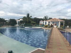 a large swimming pool in front of a house at Casa Veraneo Flandes con Piscina Privada in Flandes