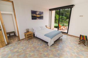 Postel nebo postele na pokoji v ubytování Hotel Casa Portones