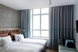Ένα ή περισσότερα κρεβάτια σε δωμάτιο στο Radisson Blu Seaside Hotel, Helsinki