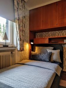 Tempat tidur dalam kamar di Haus am Park Stadtallendorf