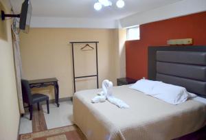 Postel nebo postele na pokoji v ubytování Hotel y Restaurante Castillo de los Altos