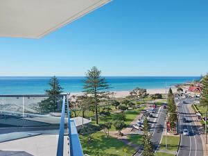 a view of the beach from the balcony of a condo at Iconic Apartments 704 in Gold Coast