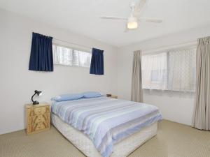 a bedroom with a bed and a ceiling fan at Maybury Unit 1 in Gold Coast