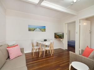 a living room with a couch and a table at Tondio Terrace Flat 5 - Pet friendly and close to the beach in Gold Coast