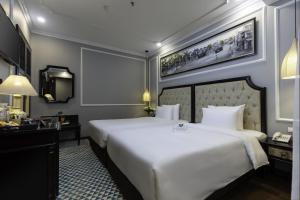 Postel nebo postele na pokoji v ubytování Babylon Premium Hotel & Spa