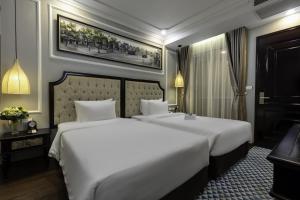 Postel nebo postele na pokoji v ubytování Babylon Premium Hotel & Spa