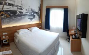 Una cama o camas en una habitación de Choice City Hotel 37 fotos más