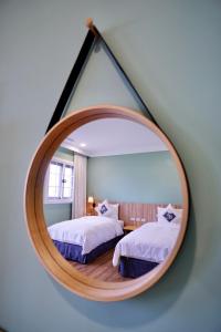 A bed or beds in a room at Dafu Qiandai Manor