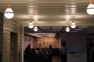 a group of people in a room with lights at Hotel The Grand Piano - Best Business Hotel in Patan in Pātan +128 photos