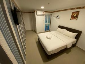 Postel nebo postele na pokoji v ubytování Shobi Hotel Johor Bahru Near CIQ JB + 36 fotografií