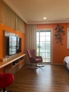 A television and/or entertainment centre at Dafu Qiandai Manor