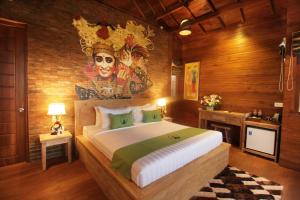 Postel nebo postele na pokoji v ubytování Alam Kawi Ubud Resort & Spa